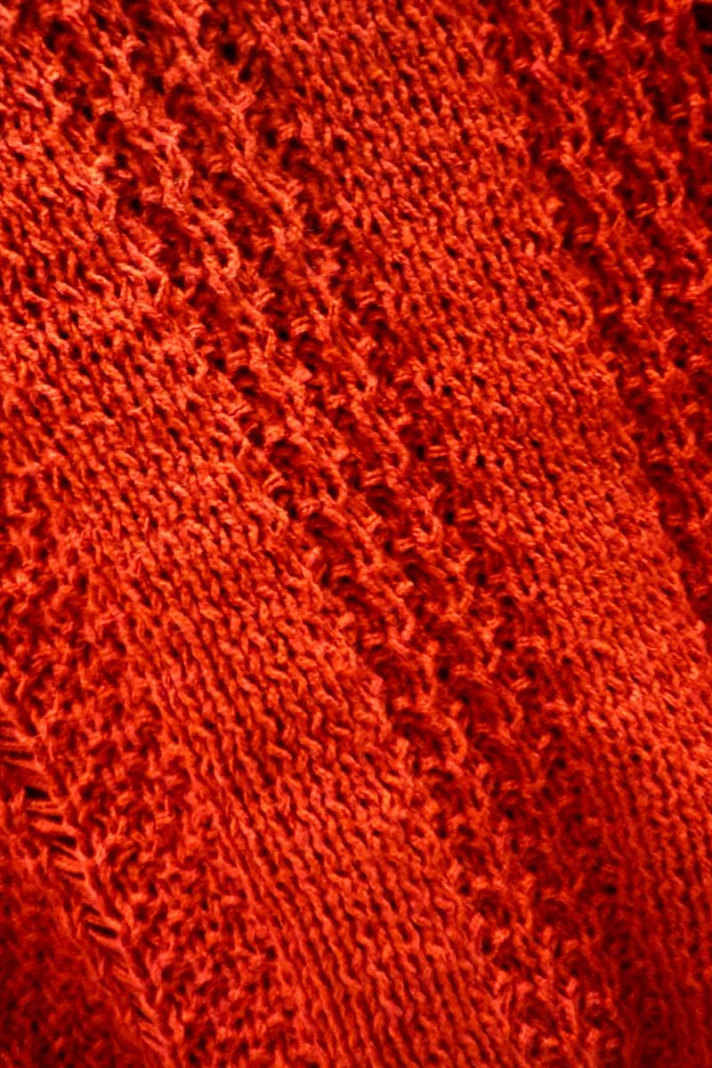 Close-up of red fabric with a textured pattern