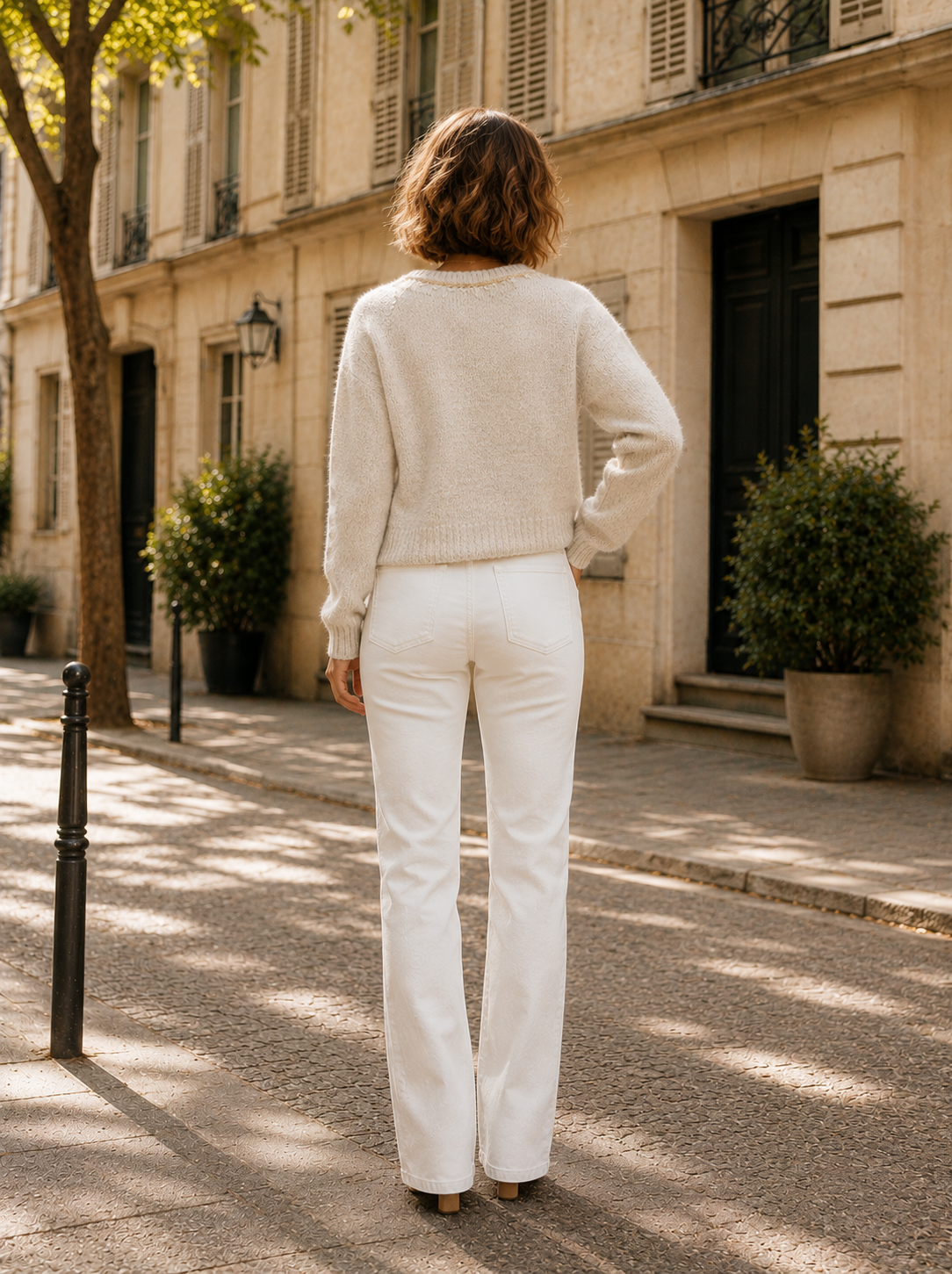 Women's cream knit tie-front cardigan with textured detailing, long sleeves, and a relaxed fit.