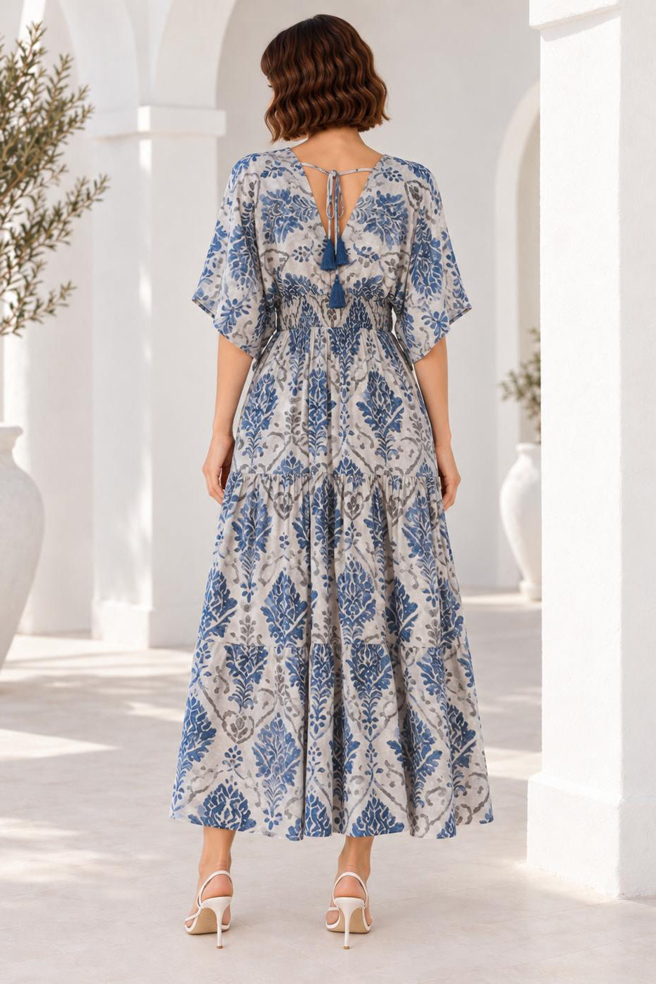 Mahi Dress blue botanical print midi dress back view showing tassel tie detail