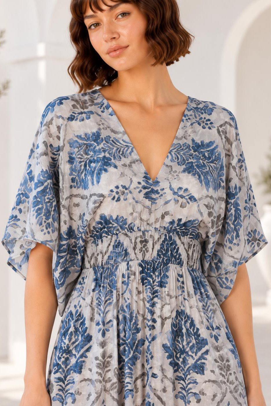 Mahi Dress blue botanical print midi dress close up of neckline and smocked waist