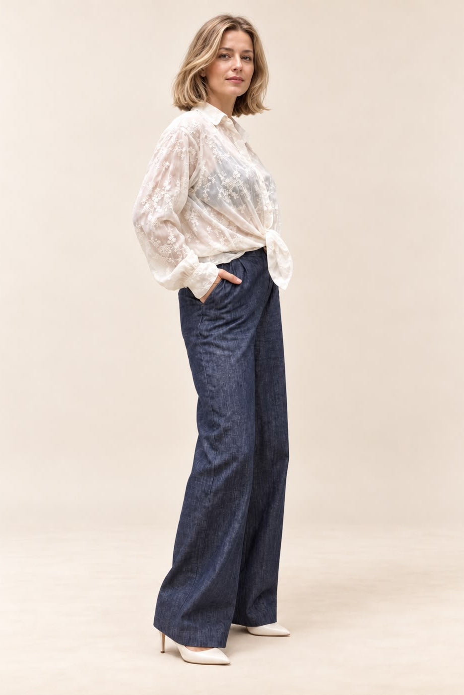 Sasha Lace Shirt in ivory - side profile view showing sheer floral lace and long sleeve detail