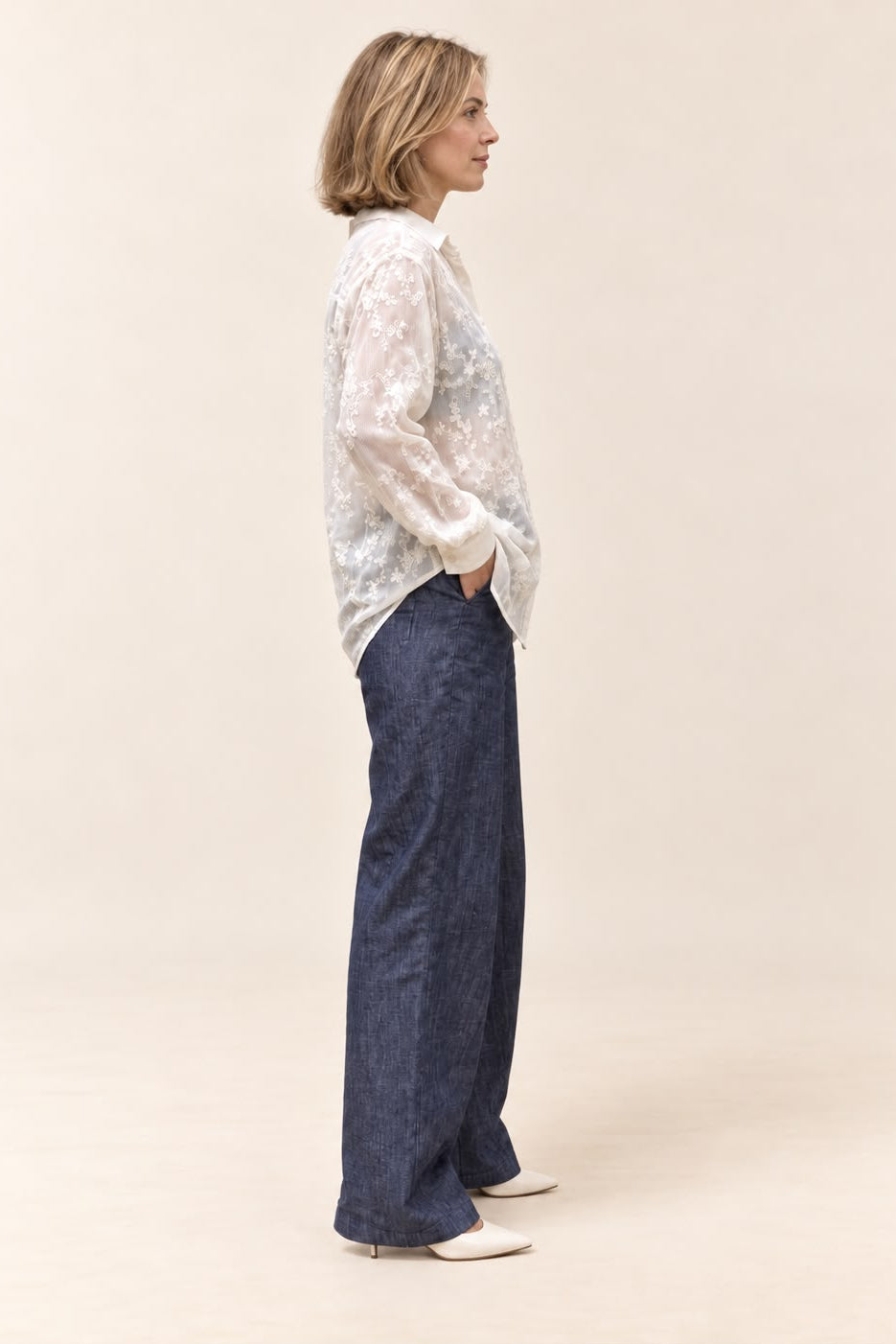 Sasha Lace Shirt in ivory - side view styled loose over wide-leg pants