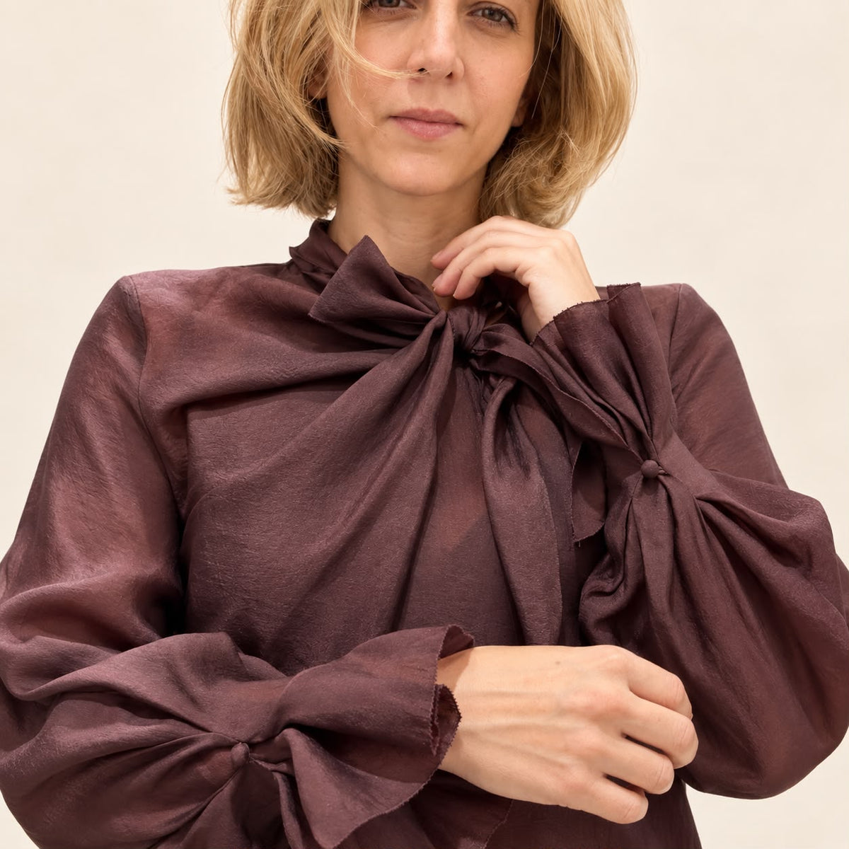 Barg Blouse Burgundy - close-up of bow-tie neckline and ruffle self-tie cuff detail